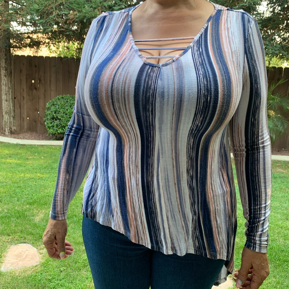 Jennifer Lopez striped asymmetrical shirt
